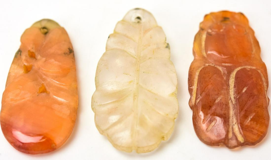 Antique Hand Carved Chinese Carnelian & Quartz: Antique Hand Carved Chinese Carnelian & Rose Quartz Pendants. Removed from an antique necklace. Each approximately 1.25 inches in length.