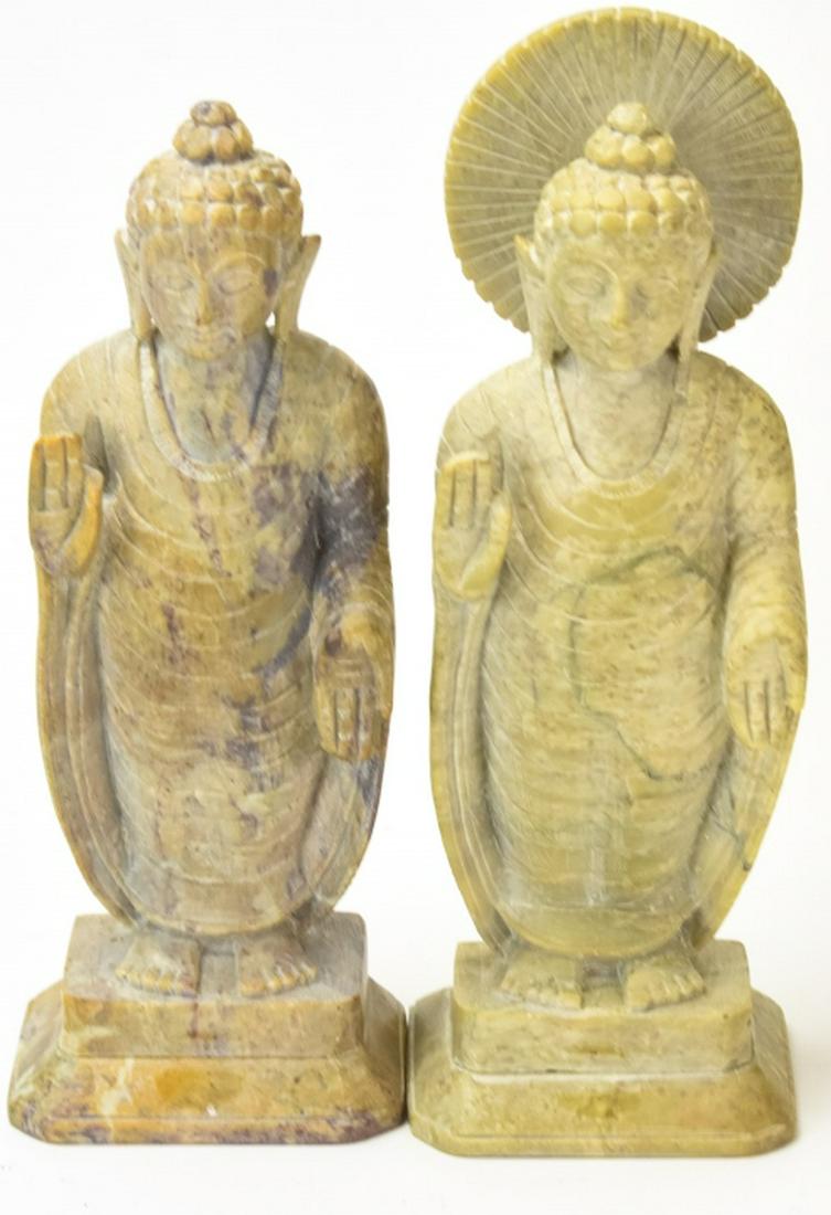 Pair Soapstone Figural Buddha / Deity Statues: Pair Soapstone Figural Buddha / Deity Statues. This lot features a pair of soapstone figural Buddha deity statues. Larger measures 9 inches x 3.25 inches x 2.5 inches.