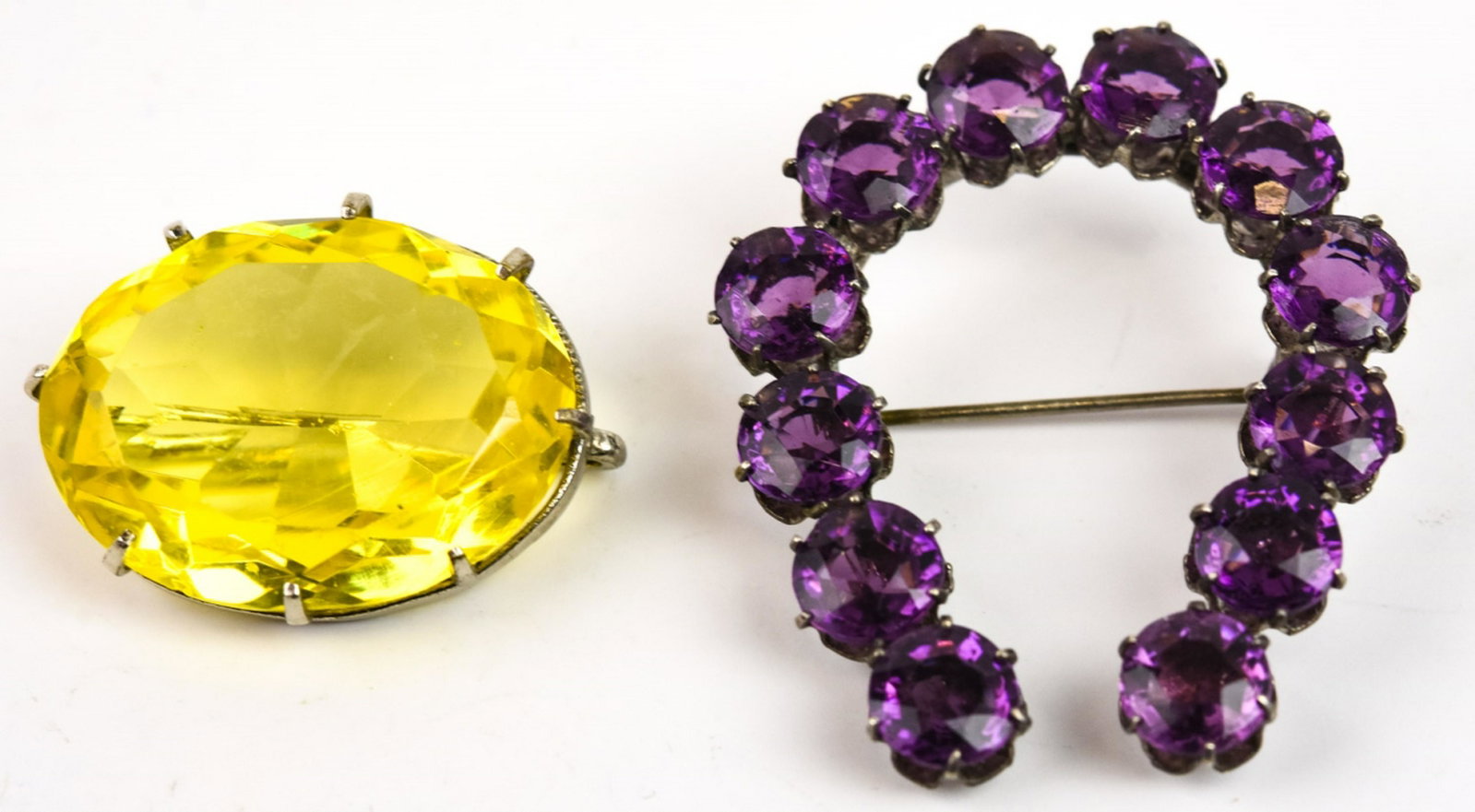 Antique Czech Crystal Brooch & Horseshoe: Antique Czech Crystal Brooch & Horseshoe. Citrine Czech crystal brooch and amethyst crystal brooch. Horseshoe measures 1.75 inches in length.