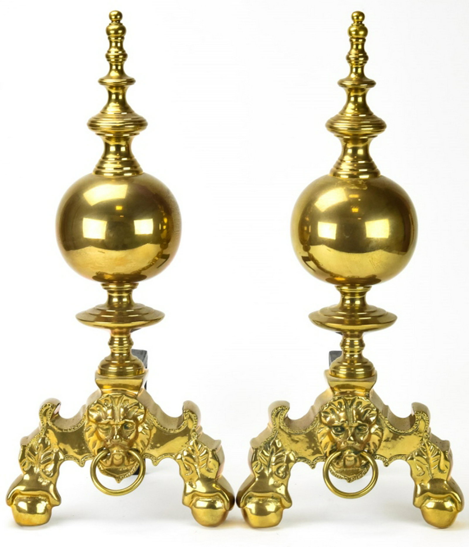 Pair French Empire Style Brass Lions Head Andirons: Pair French Empire Style Brass Lions Head Andirons. Featuring a lion head motif at front. Each measures approximately 21.5 inches x 9 inches x 8 inches.