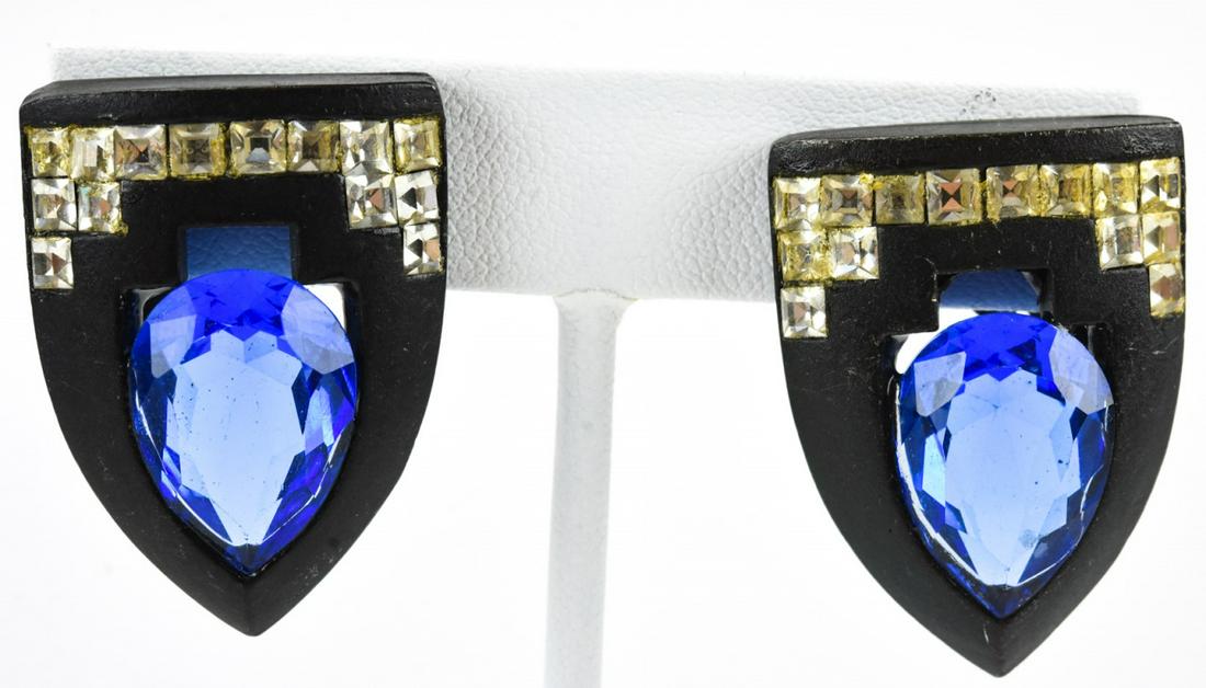 Angela Kramer Shield Shaped Rhinestone Earrings: Angela Kramer Shield Shaped Rhinestone Earrings. Signed clip on earrings. Each measures approximately 1.25 inches.