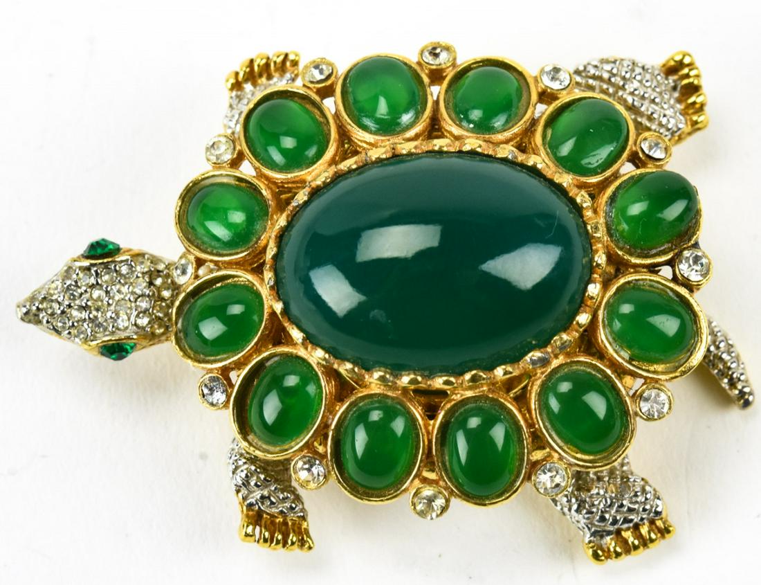 Kenneth J Lane Turtle Brooch W Watch Locket: Kenneth J Lane Turtle Brooch W Watch Locket. Brooch or pendant with rhinestone and green cabochons. Back lifts to show a la tour 17 jewels watch. Circa 1980s.