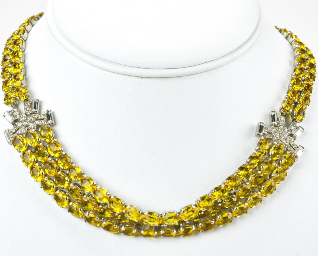 Circa 1920s Czech Glass Rhinestone Necklace: Circa 1920s Czech Glass Rhinestone Necklace. Czech two to three strand necklace with yellow and clear paste. Marked on clasp. 15 inches in length.
