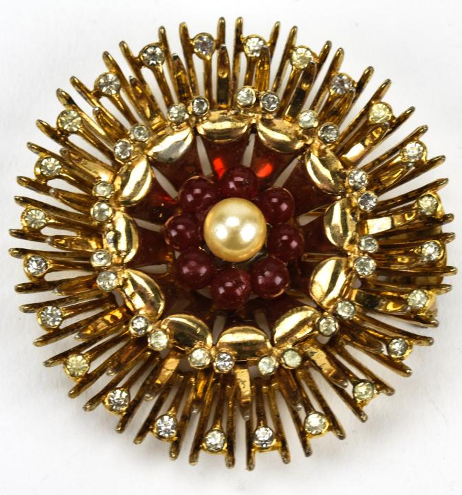 Vintage Sterling R De Rosa Rhinestone Brooch: Vintage Sterling R De Rosa Rhinestone Brooch. Floral design set with paste stones and ruby tone beads circa 1940s. 2.25 inches in diameter. Signed and hallmarked.
