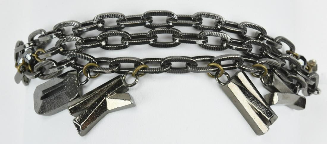 DKNY Gunmetal Finish Bracelet: DKNY Gunmetal Finish Bracelet. Triple strand. Measures 8 inches in length.
