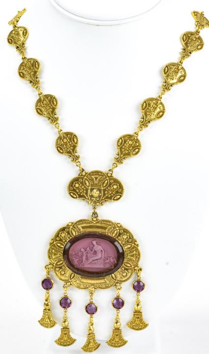 Vintage Gilt Metal C 1970s Necklace by Goldette: Vintage Gilt Metal C 1970s Necklace by Goldette. Pink glass intaglio with dangles. Fancy link design. Chain measures 23 inches, pendant measures 5 inches.
