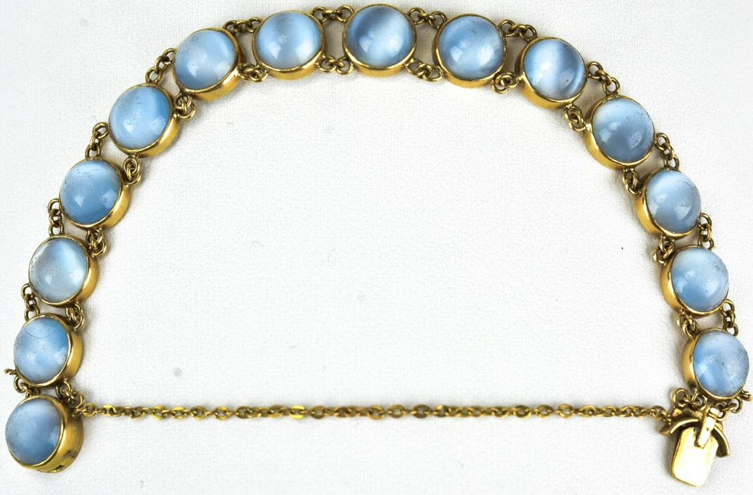 Estate 18k Yellow Gold Cabochon Moonstone Bracelet: Estate 18k Yellow Gold Cabochon Moonstone Bracelet. Set with 14 round cut moonstone cabochons. Measures approximately 5 inches in length, with safety chain.
