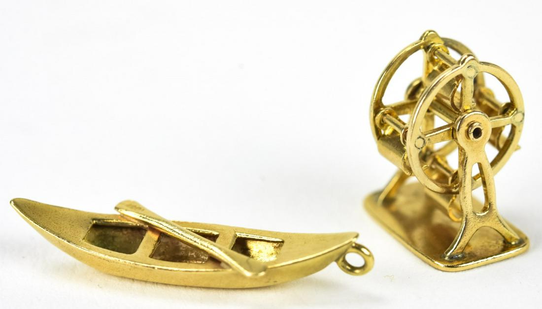 Two Vintage 14kt Yellow Gold Charms: Two Vintage 14kt Yellow Gold Charms. Canoe and Ferris wheel. Each under 1 inch in length.