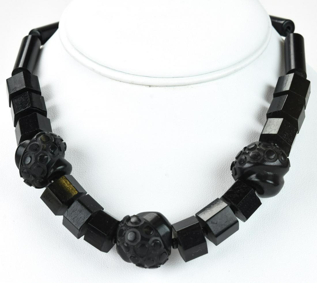 Vintage Carved Black Bakelite Necklace: Vintage Carved Black Bakelite Necklace. Measures 16 inches in length.