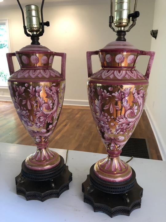Hollywood Regency Porcelain + Brass Amphora Lamps: Pair Hollywood Regency Porcelain + Brass Amphora Lamps. Hand painted porcelain amphora style urn form rose and gold leaf lamps with reticulated brass bases. 29 inches x 7 inches in diameter.