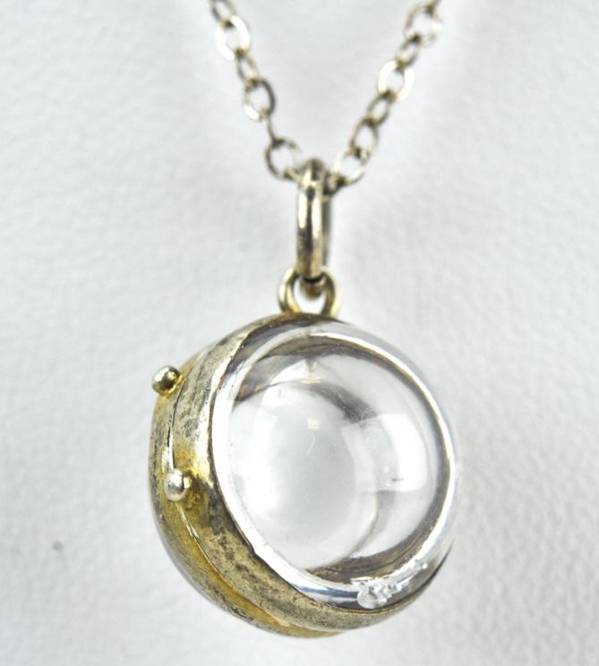 Vintage Locket Form Magnifying Glass Pendant: Vintage Locket Form Magnifying Glass Pendant. Silver framed. Sterling chain measures 17 inches in length.