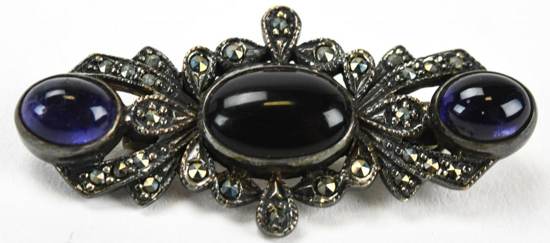 Sterling Amethyst Onyx Marcasite Brooch Pin: Sterling Amethyst Onyx Marcasite Brooch Pin. Hallmarked. Measures 1.75 inches in length.