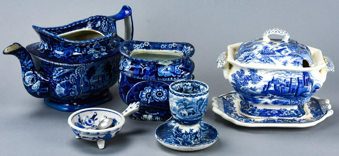 Collection Blue & White Ironstone Serveware Pieces: Collection Blue & White Ironstone Serveware Pieces. Includes teapot, covered tureen, sugar bowl, egg cup and small bowl. Some pieces are marked. Teapot measures 6.25 inches x 11 inches x 5 inches.