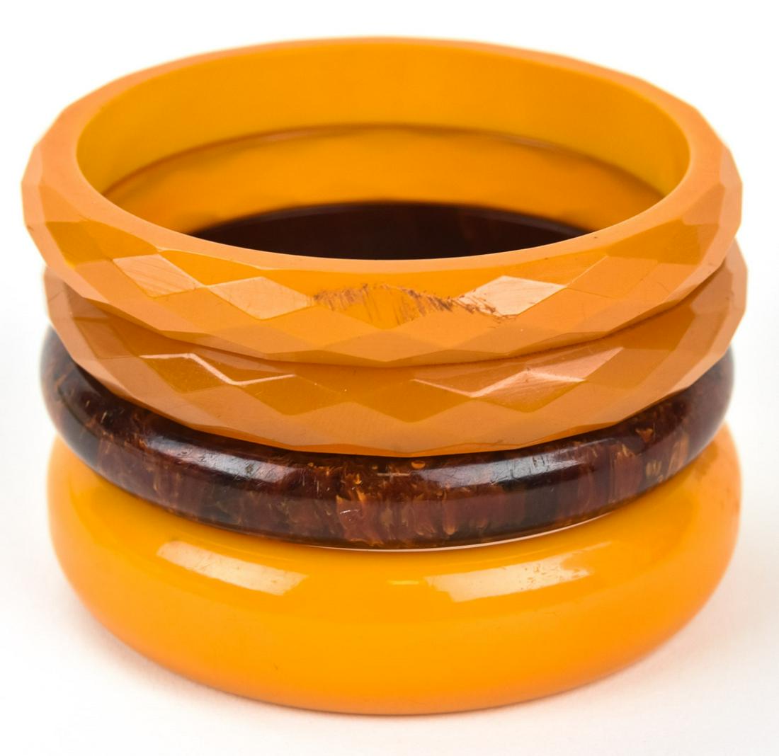 4 Vintage Butterscotch & Amber Bakelite Bracelets: 4 Vintage Butterscotch & Amber Bakelite Bracelets. Two with faceted design. Each approximately 2.5 inches across the opening.