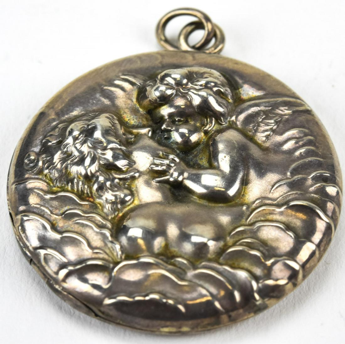 Antique Sterling Silver Cupid & Psyche Locket: Antique Sterling Silver Cupid & Psyche Locket. Repousse sterling silver antique locket. Measures 2 inches with bail.