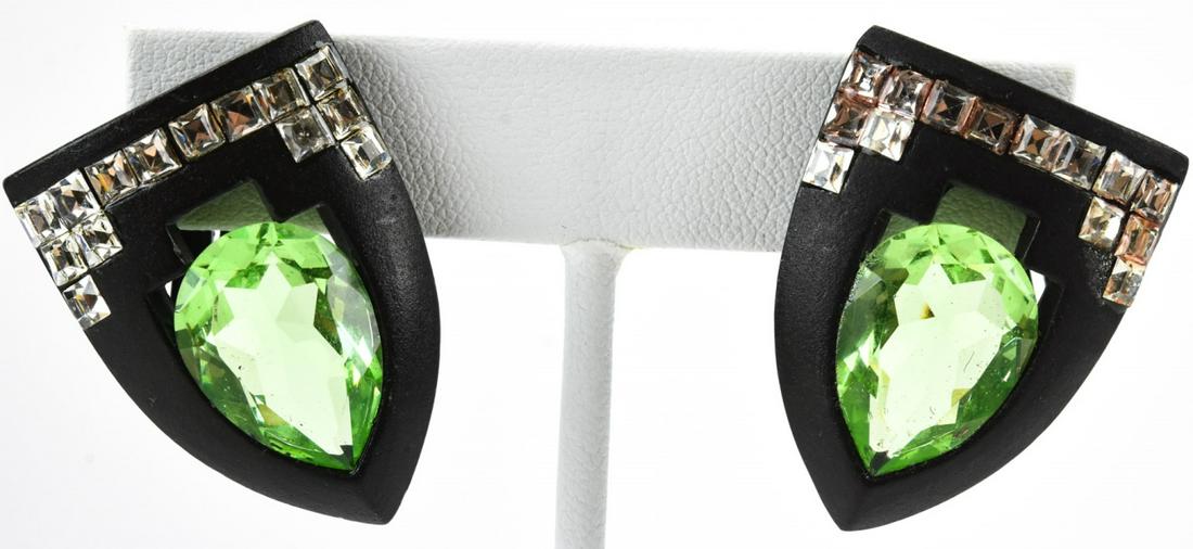 Angela Kramer Shield Shaped Rhinestone Earrings: Angela Kramer Shield Shaped Rhinestone Earrings. Signed clip on earrings. Each measures approximately 1.25 inches.