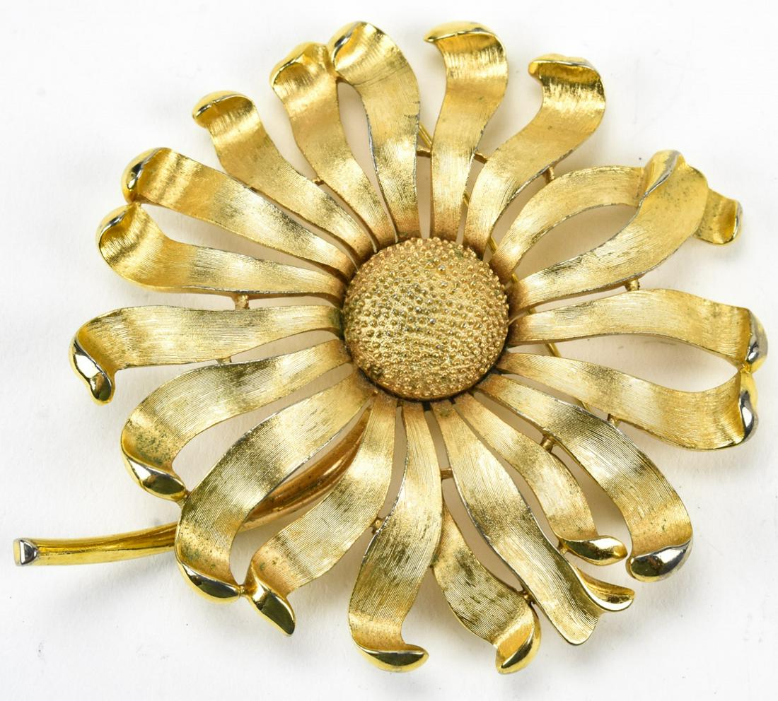Large Vintage Trifari Gilt Metal Flower Brooch: Large Vintage Trifari Gilt Metal Flower Brooch. Textured finish. Measures 3.75 inches in length.