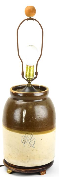 Antique Stoneware Jug Converted Table Lamp: Antique Stoneware Jug Converted Table Lamp. Antique stoneware jug converted into a table lamp. Measures 27 inches x 7 inches with harp.