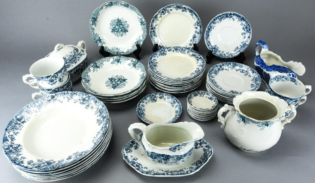 Lot of Blue & White Ironstone Serveware: Lot of Blue & White Ironstone Serveware. Makers include JHW & Sons and John Maddock & Sons. Includes 10 bread plates, 9 saucers, 9 condiment dishes, 5 coffee cups, 7 cream bowls, 5 soup bowls, 2 gravy