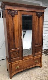 Vintage Carved Armoire W Full Length Mirror: Vintage Carved Armoire W Full Length Mirror. Vintage armoire with hand carved details, full length mirror at front. Features lower drawer for storage. 79 inches x 45 inches x 19.5 inches.