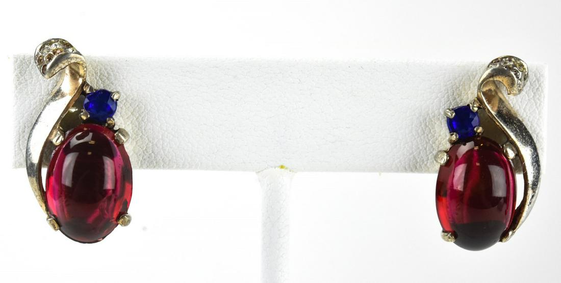 Pair Trifari Crown Sterling & Cabochon Earrings: Pair Trifari Crown Sterling & Cabochon Earrings. Pair of sterling silver and faux ruby cabochon clip earrings by Trifari. Hallmarked. Each measures 1 inch in length. Circa 1945.