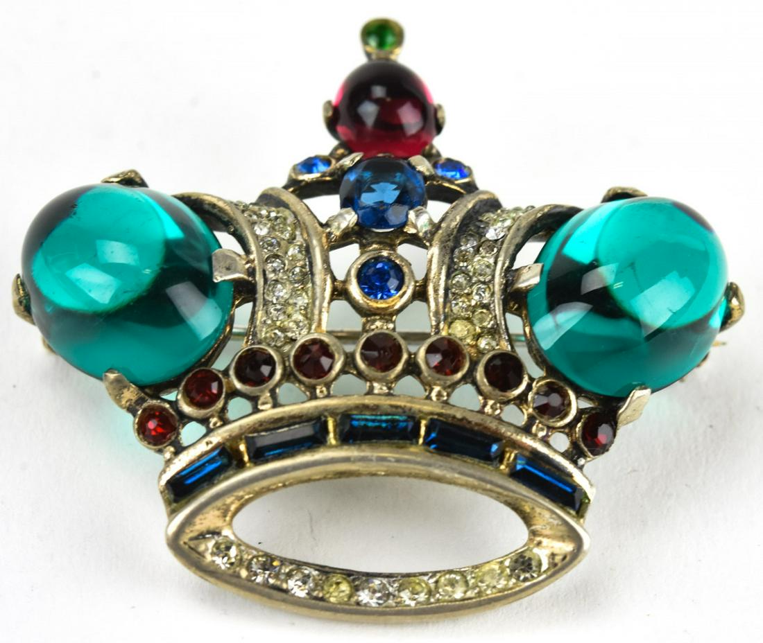Trifari Crown Sterling & Cabochon Crown Brooch: Trifari Crown Sterling & Cabochon Crown Brooch. Crown motif sterling and faux emerald paste cabochon brooch by Trifari. Hallmarked on back. Patent number 137542. Circa 1945. Measures 1.75 inches x 2 i
