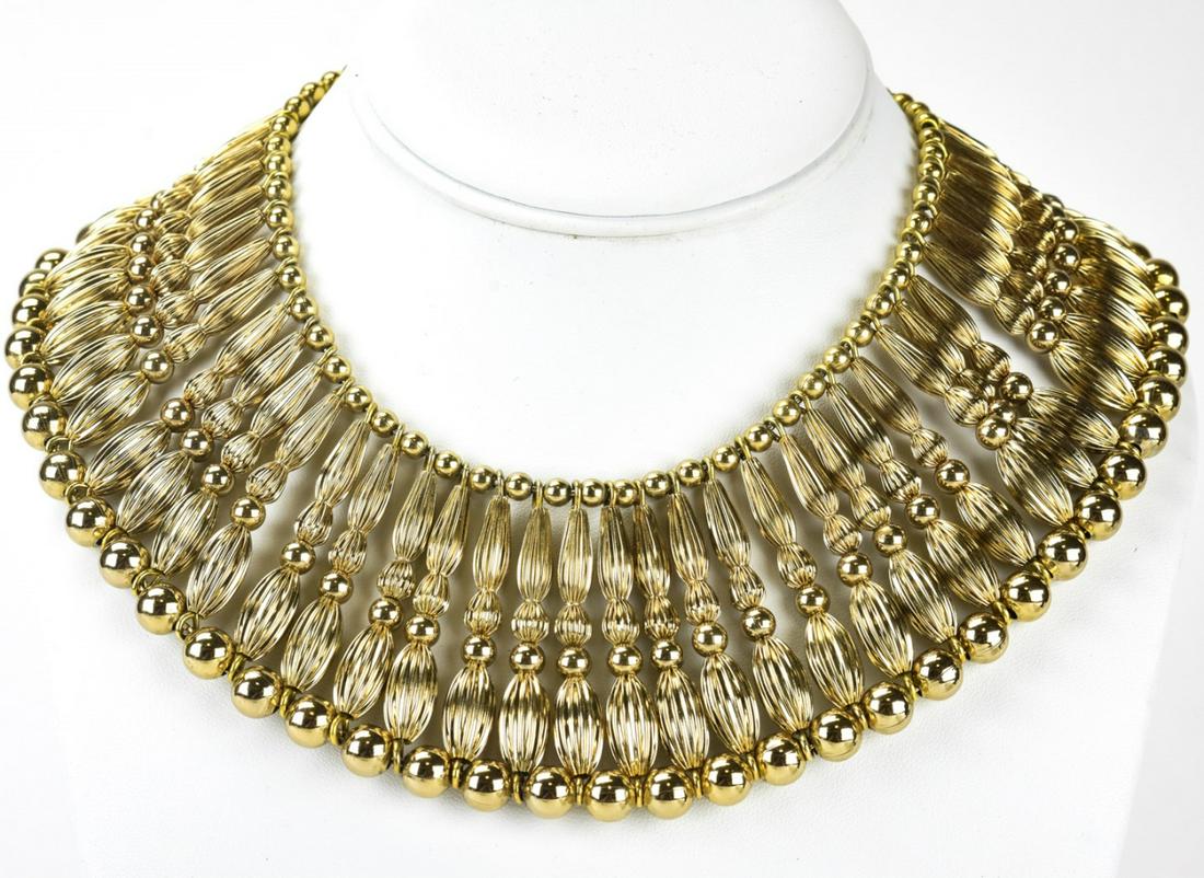 Monet C 1950s Gilt Brass Egyptian Collar Necklace: Monet C 1950s Gilt Brass Egyptian Collar Necklace. Monet circa 1950s elaborate gilt brass reeded bead Egyptian collar design necklace. Hallmarked on clasp. Measures approximately 13 inches in length.