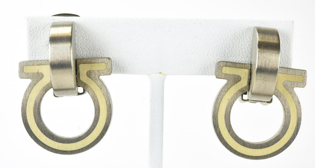 Pair Ferragamo Italy Silver Tone & Enamel Earrings: Pair Ferragamo Italy Silver Tone & Enamel Earrings. Pair of brushed silver tone and white enamel clip earrings by Ferragamo, signed. Circa 1980. Each measures 1.5 inches in length.