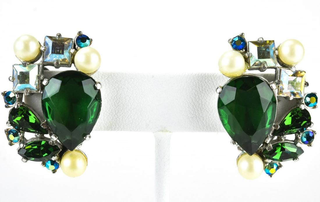 Schiaparelli C 1955 Rhinestone Cluster Earrings: Elsa SchiaparelliC 1955 Rhinestone Cluster Earrings. Pair clip earrings by Schiaparelli with green and iridescent rhinestones and faux pearls, abstract cluster design in rhodium. Signed on clips. Each