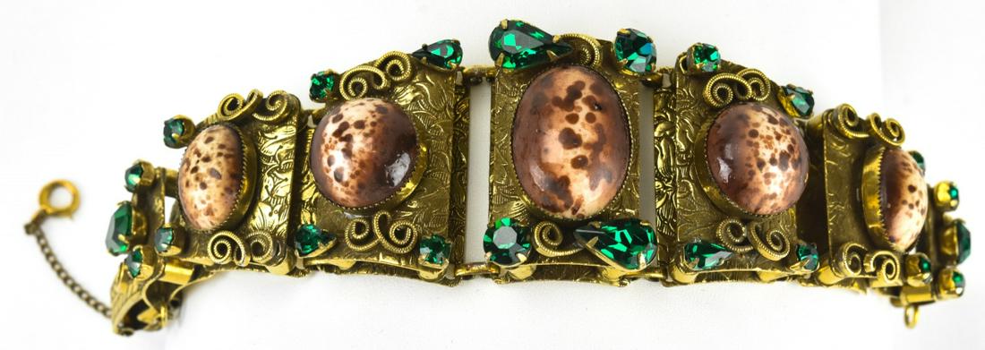1950s Chunky Link Faux Shell Panel Bracelet: 1950s Chunky Link Faux Shell Panel Bracelet. Panel bracelet set with faux shell cabochons and emerald toned rhinestones. Fold over clasp, with safety chain. 7 inches in length.