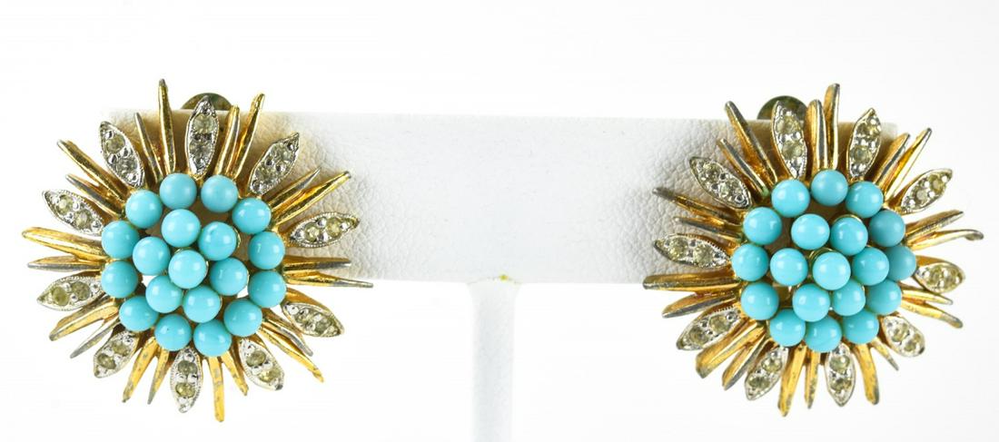 Pair Jomaz C 1970 Turquoise Cluster Earrings: Pair Jomaz C 1970 Turquoise Cluster Earrings. Pair clip earring with faux turquoise cluster at center and clear paste. Floral design. Signed on clip. Each measures just over 1 inch in diameter.