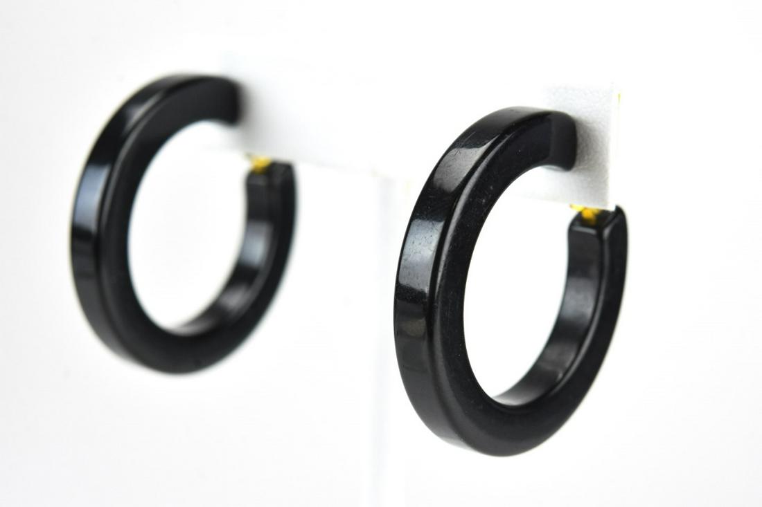 Vintage Pair of Carved Hoop Bakelite Earrings: Vintage Pair of Carved Hoop Bakelite Earrings. Measure 1.5 inches in diameter. Clip on earrings.