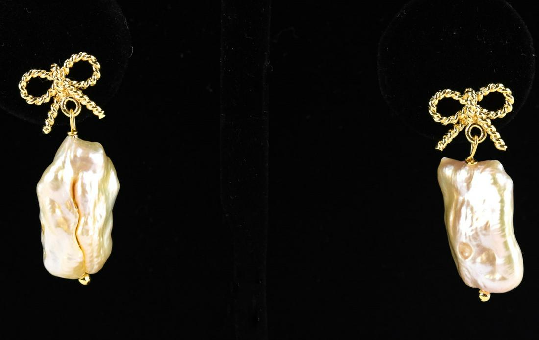 Large Cultured Baroque Pearl Earrings w 14kt Gold: Pair of Large Cultured Baroque Pearl Earrings w 14kt Gold Earring Backs. Bow motif at top. High luster cultured pearls with pink and champagne tones. Each measures nearly 1.5 inches in length.