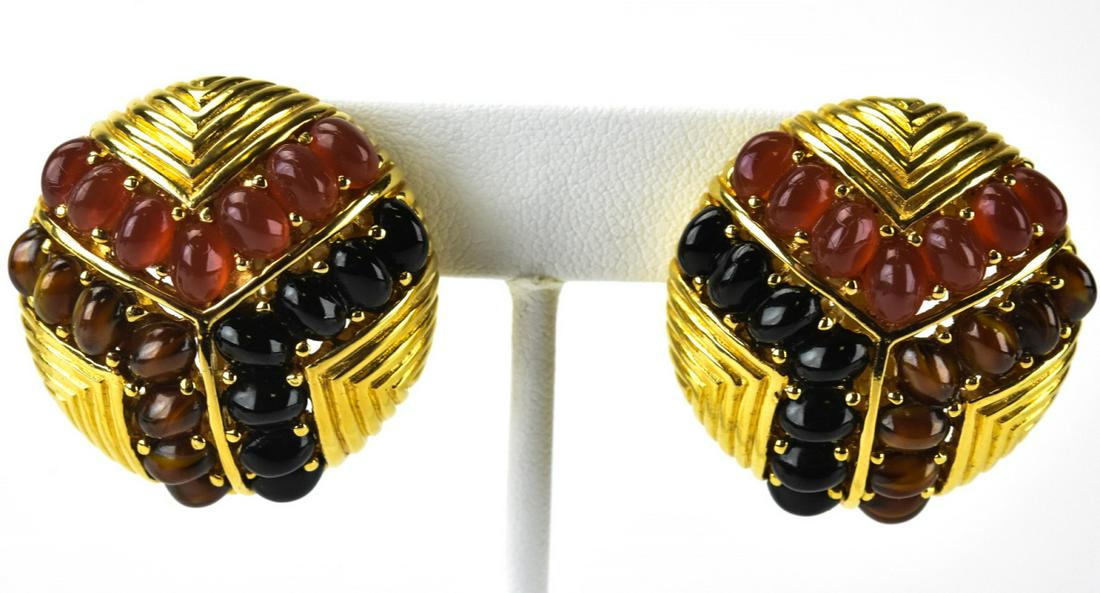 Pair Ciner C 1960 Natural Stone Cabochon Earrings: Pair Ciner C 1960 Natural Stone Cabochon Earrings. Pair clip earrings by Ciner, each featuring natural tigers eye, carnelian and onyx cabochons set in gilt metal domes. Signed on clips. Each measures