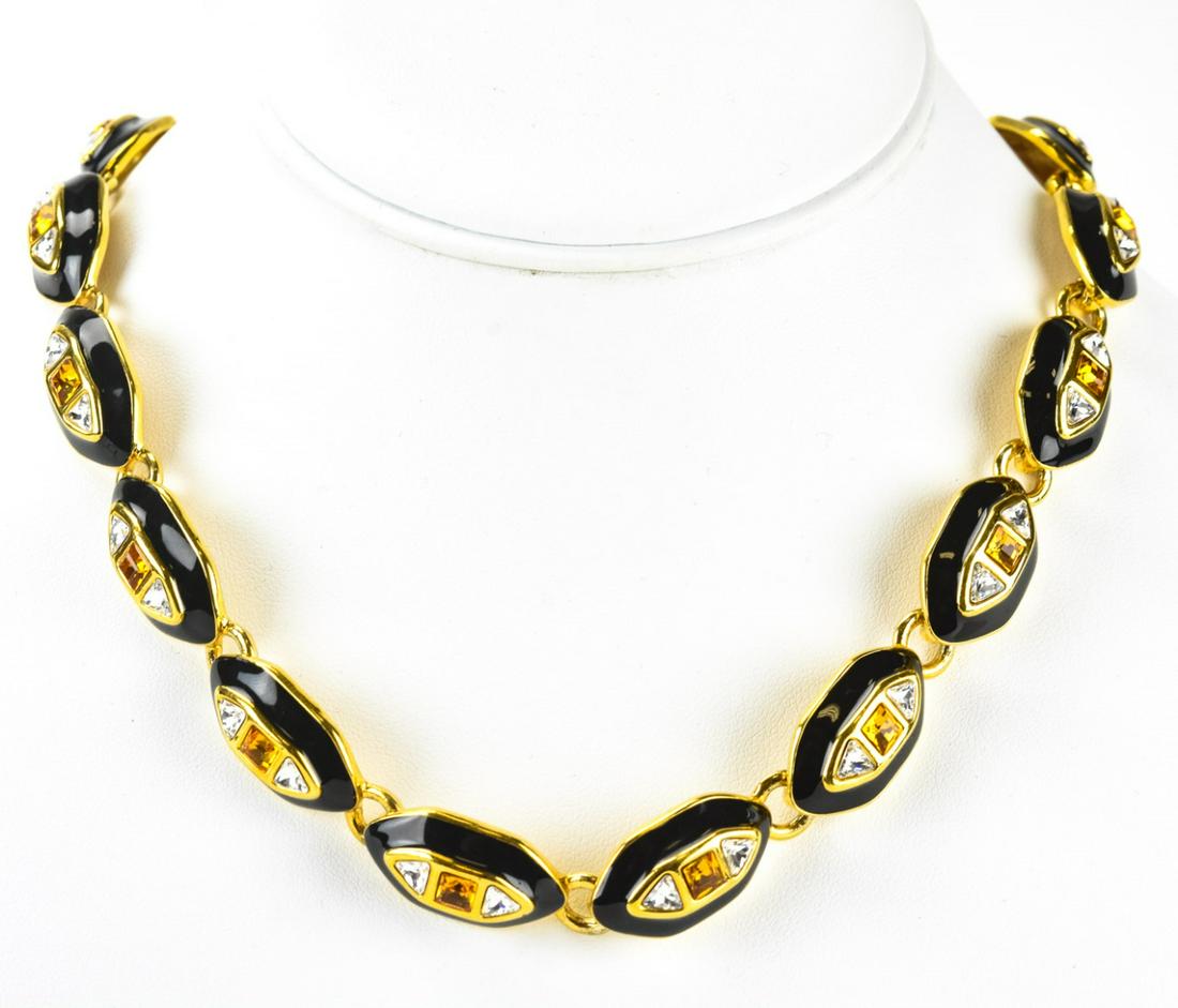 Monet Black Enamel & Citrine Rhinestone Necklace: Monet Black Enamel & Citrine Rhinestone Necklace. Monet gilt metal necklace with black enamel and citrine tone and clear rhinestones. Signed. Measures Measures 16.5 inches.