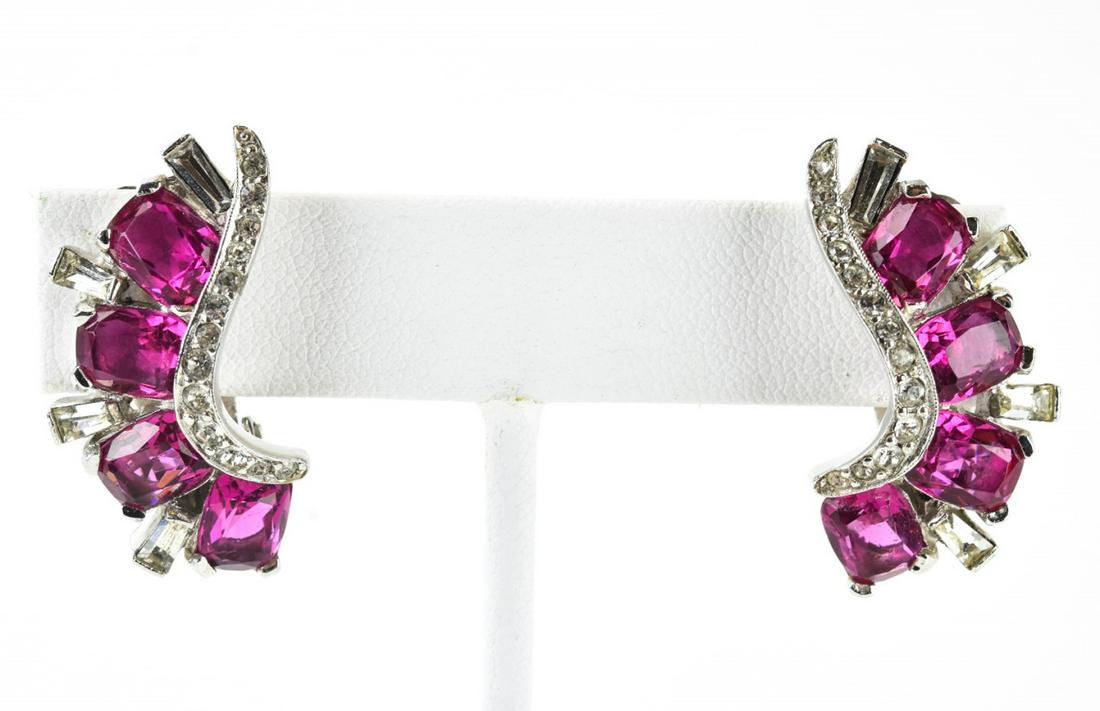 Pair Jomaz C 1980 Sapphire Paste Earrings: Pair Jomaz C 1980 Sapphire Paste Earrings. Pair clip earrings with sapphire and clear paste in rhodium, signed Jomaz. Each measures 1.25 inches in length.