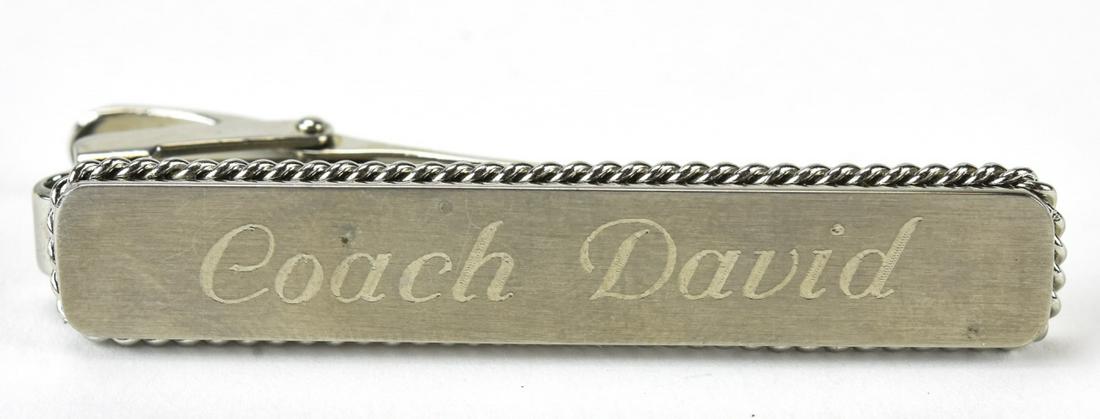 1980s Stainless Steel "Coach David" Tie Clip: 1980s Stainless Steel "Coach David" Tie Clip. Engraved "Coach David". Measures 2 1/8 inches.