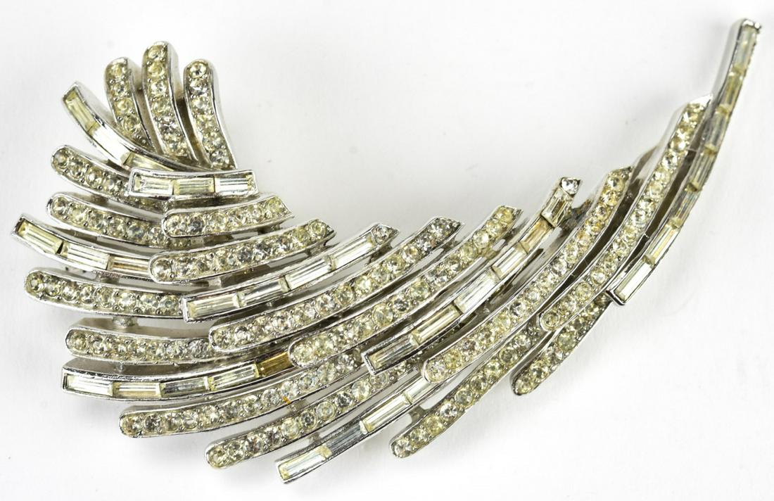 Trifari C 1970 Layered Spray Design Brooch: Trifari C 1970 Layered Spray Design Brooch. With baguette and round clear paste set in rhodium. Measures 3 1/8 inches. Signed on back.