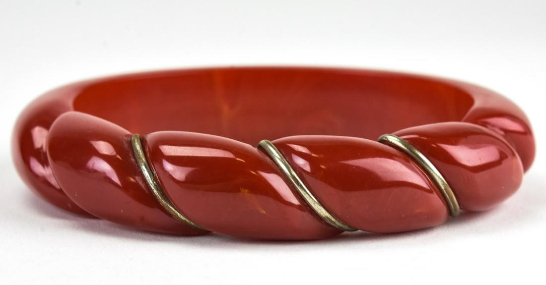 Oval Red Bakelite & Wrapped Wire Bangle Bracelet: Oval Red Bakelite & Wrapped Wire Bangle Bracelet. Measures 2.75 inches across interior opening.