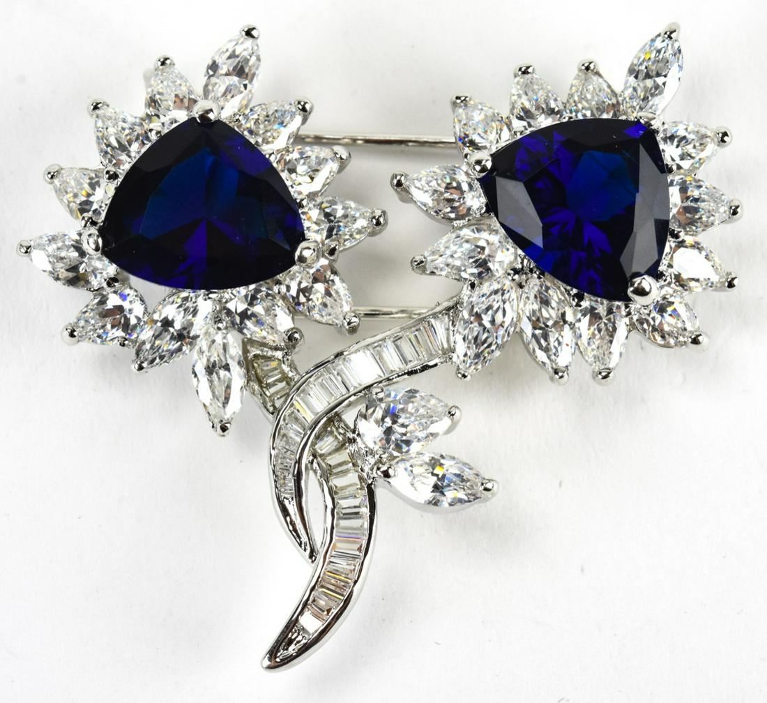 Harry Winston Style C 1990 Faux Diamond Brooch: Harry Winston Style C 1990 Faux Diamond Brooch or Pendant. With prong set faux diamonds and faux sapphires. 1.75 inches x 2 inches.