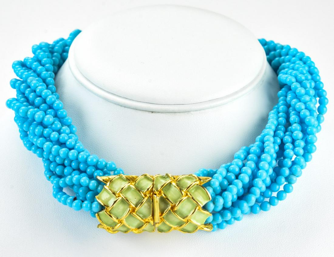 Kenneth J Lane Multi Strand Turquoise Necklace: Kenneth J Lane Multi Strand Turquoise Necklace. Circa 1970 multi strand faux turquoise necklace with gilt enamel clasp by KJL. Measures 15 inches.