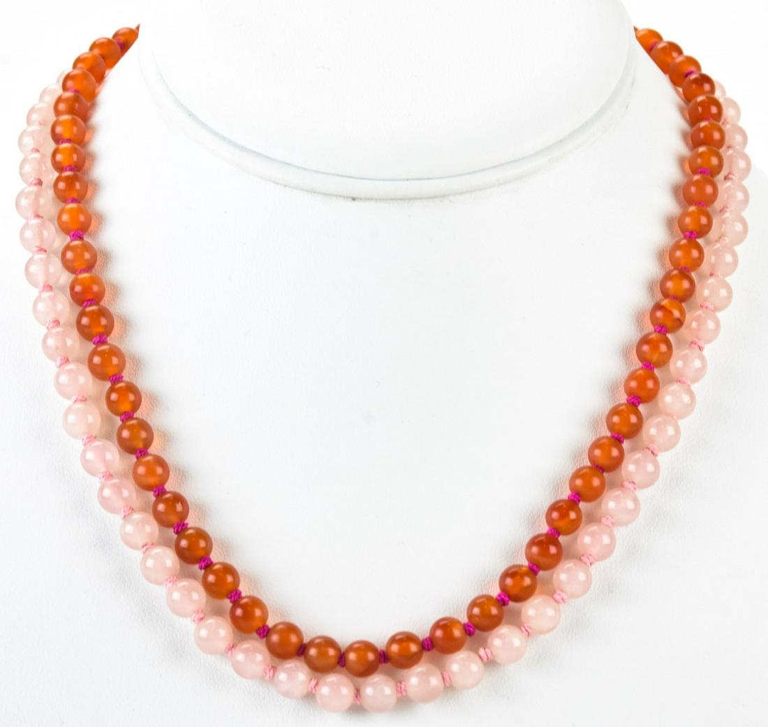 Two Chinese Necklaces in Rose Quartz & Carnelian: Two Chinese Necklaces in Rose Quartz & Carnelian. Chinese silver clasps. Hand knotted. Each approximately 17 inches in length.