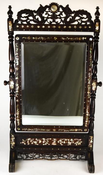 Antique Ornately Carved Inlaid Mirror Serpents: Antique Ornately Carved Inlaid Shell Inlaid Mirror with Serpent Motif. Standing counter top heavily carved and pierced mirror with dragon motif and mother of pearl inlay. Mirror is beveled glass and i