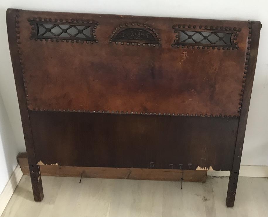 Antique Carved Wood Leather Upholstered Headboard: Antique Carved Wood Leather Upholstered Headboard. Twin size. 39 inches x 42 inches.