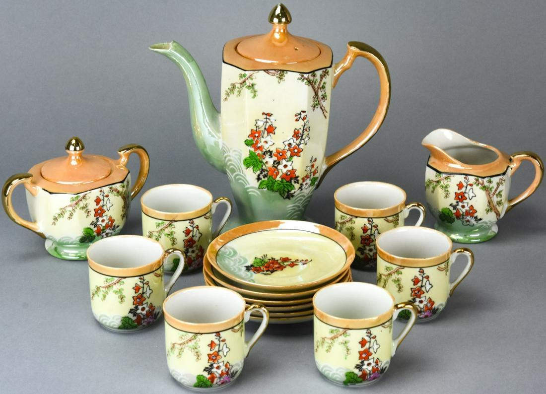 Japanese Lusterware Demitasse Set for 6: Japanese Lusterware Demitasse Set for 6. With hand painted floral motif. Includes coffee pot, creamer, sugar, six cups and saucers. Coffee pot measures 8 inches x 7 inches x 3.5 inches.