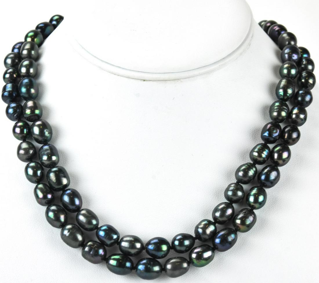 Pair Baroque Tahitian Pearl Hand Knotted Necklaces: Pair Baroque Tahitian Pearl Hand Knotted Necklaces. Hand knotted on silk thread. Baroque pearls with tones of grey, silver and black. Each strand measures just over 18 inches in length.