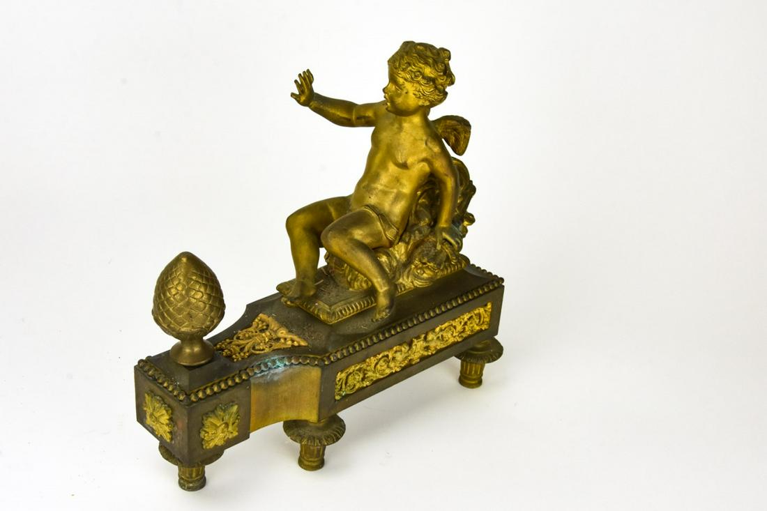 Pair 19th Century Gilded Bronze Putti Chenets: Pair 19th Century French Gilded Bronze Putti Chenets. Featuring Putti a top bronze base with ormolu detail. 11 inches x 10 inches x 4 inches