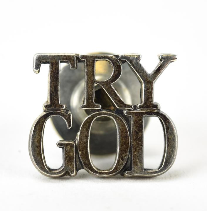 Tiffany & Co Sterling Silver Try God Pin: Tiffany & Co Sterling Silver Try God Pin. Hallmarked and signed. Measures 1/2 an inch in width