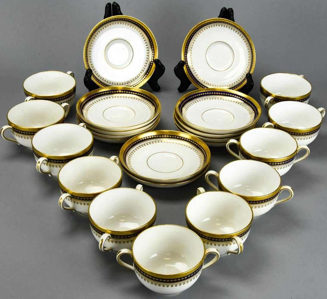 Copelands Spode China Broth Cups & Saucers: Copelands Spode China Broth Cups & Saucers. Navy blue and gold rim, 2 handled cups with saucer. 11 cups and 12 saucers. Saucers measure approximately 6 inches in diameter. Carries makers mark.