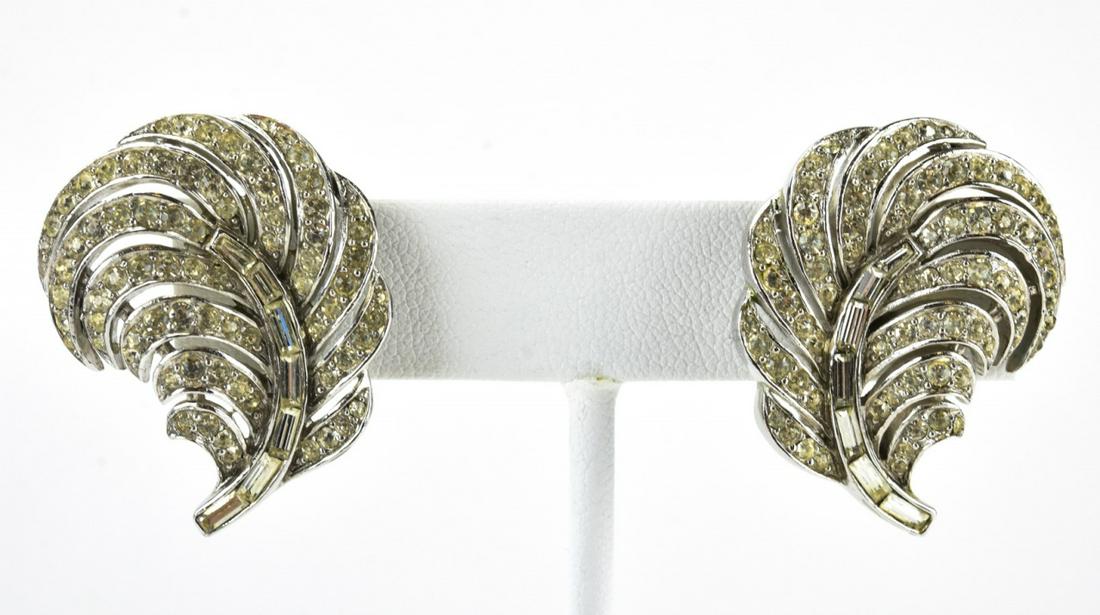 Vintage 1960s Trifari Rhinestone Feather Earrings: Pair of Vintage 1960s Trifari Rhinestone Feather Earrings. Clip ons. Signed. Each measures 1 inch in length.